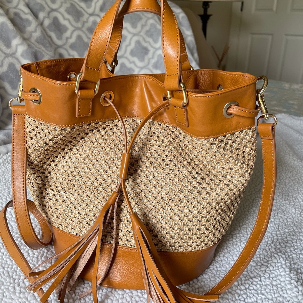 Straw drawstring with leather trim bag..